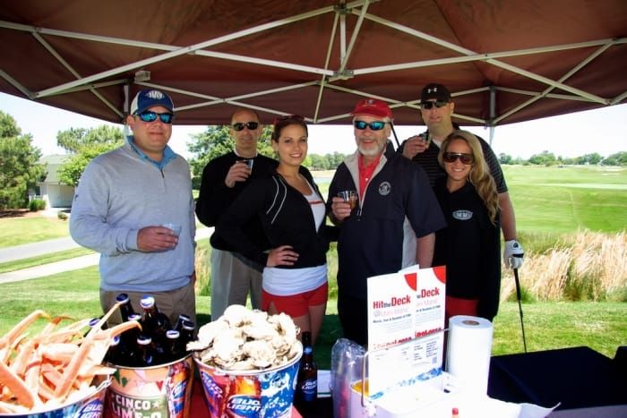 029c400ae4efbb38b2f87945646f31f4 Group posing for photo at Neptune's Invitational Golf Tournament