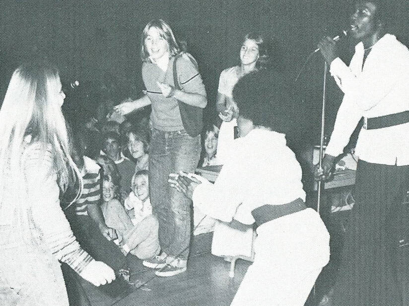 Photo from 1977 Neptune Festival guide of group singing and dancing