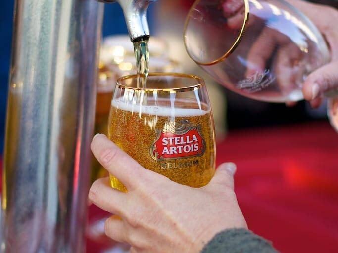 Pouring a beer at King Neptune's Invitational Golf Tournament
