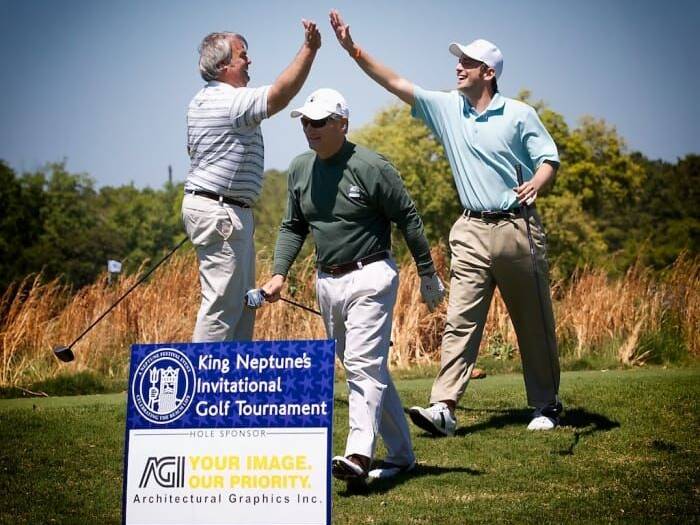 Golfers celebrating at King Neptune's Invitational Golf Tournament