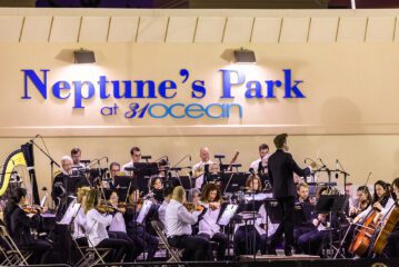 Symphony by the Sea musicians and conductor on stage