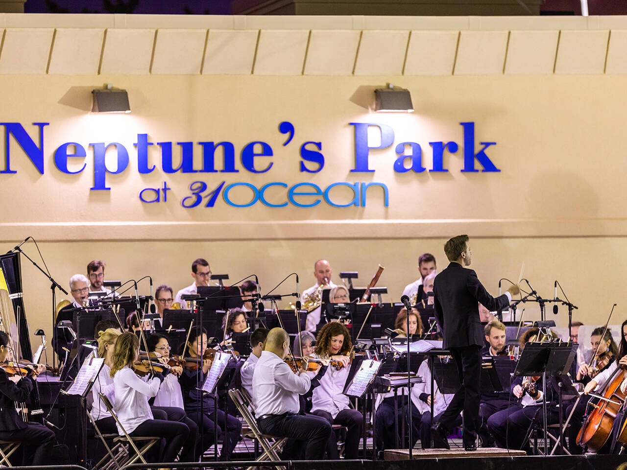 Symphony by the Sea musicians and conductor on stage