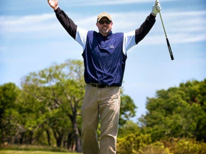 Golfer celebrating at King Neptune's Invitational Golf Tournament
