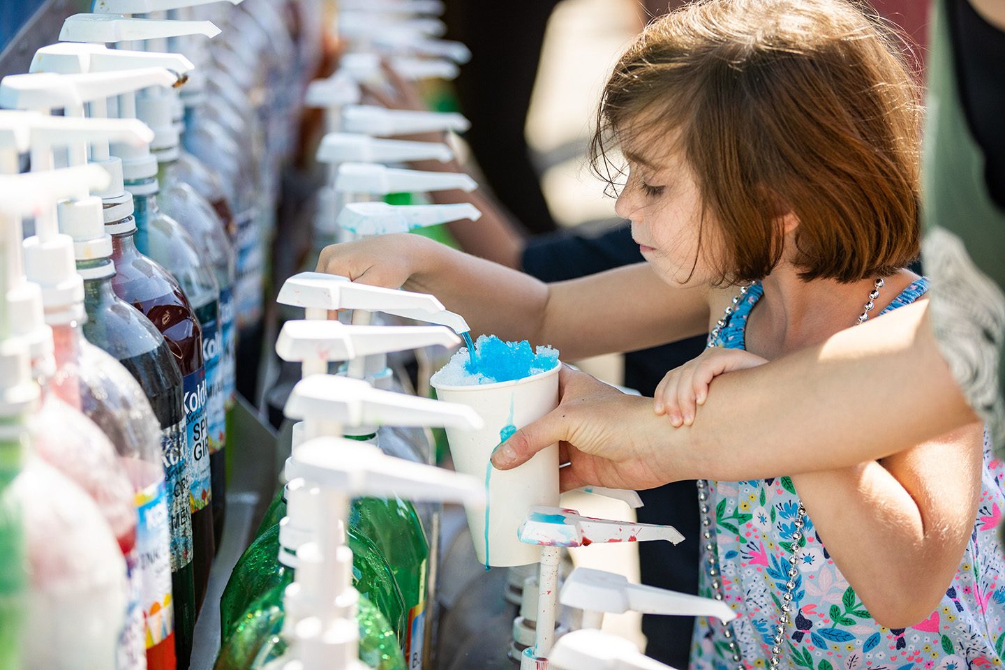 Kids getting shaved ice at Neptune Festival Boardwalk Weekend