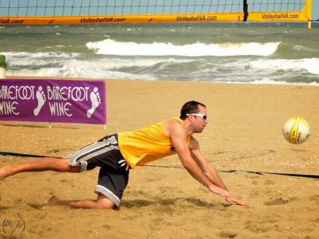 Player hitting ball at Neptune's Volleyball Tournament