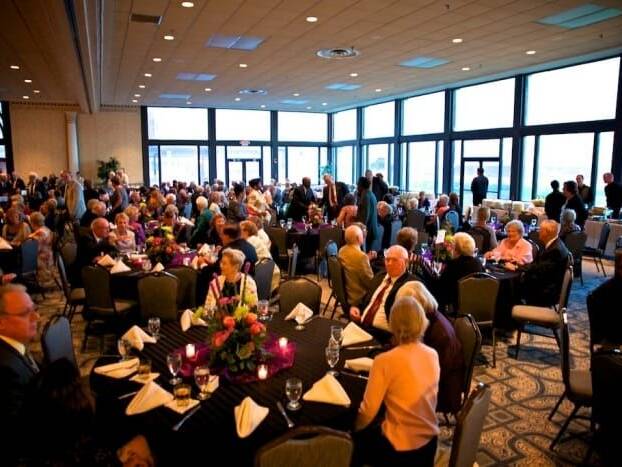 People gathered in ballroom during Seniors Gala