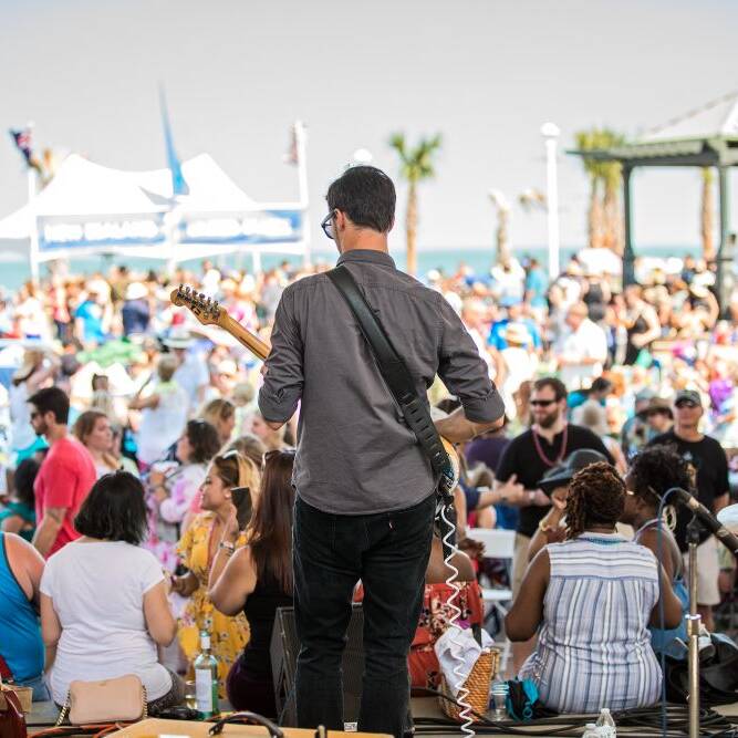 Band performing looking into crowd at Neptune's 25th Annual Fall Wine Festival