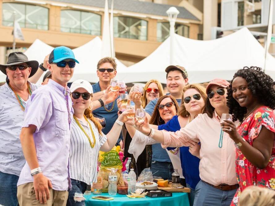 Group posing for photo at Neptune's 25th Annual Fall Wine Festival