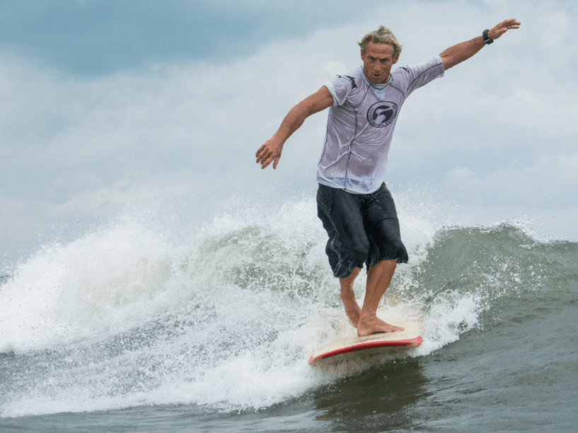 Surfer on wave during Neptune's Surfing Classic