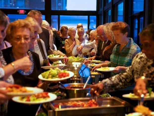 People getting food at Seniors Gala