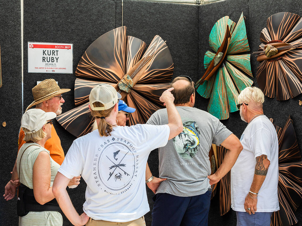 People viewing art on Boardwalk during Neptune's Art & Craft Show