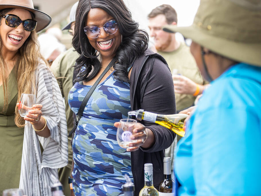 Ladies getting a refill at Spring Wine Festival