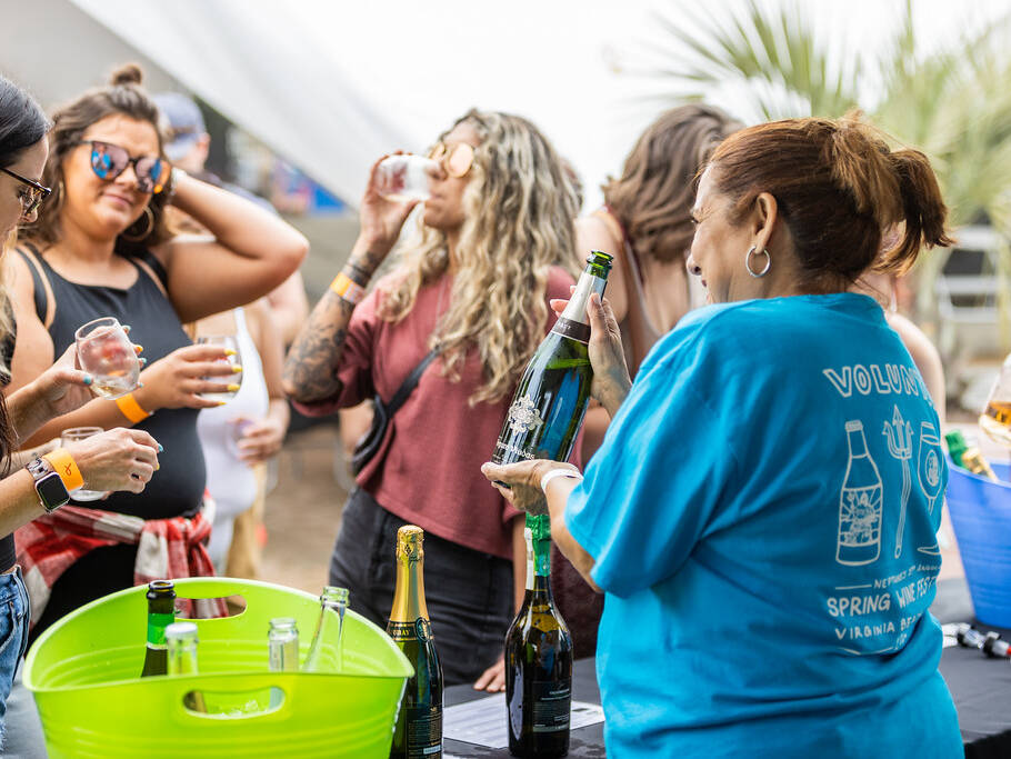 Group getting wine from volunteer at Spring Wine Festival