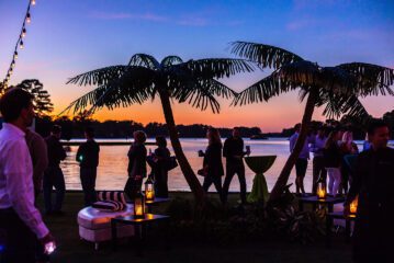 Silhouette of trees and people during sunset at End of Summer Bay Basha