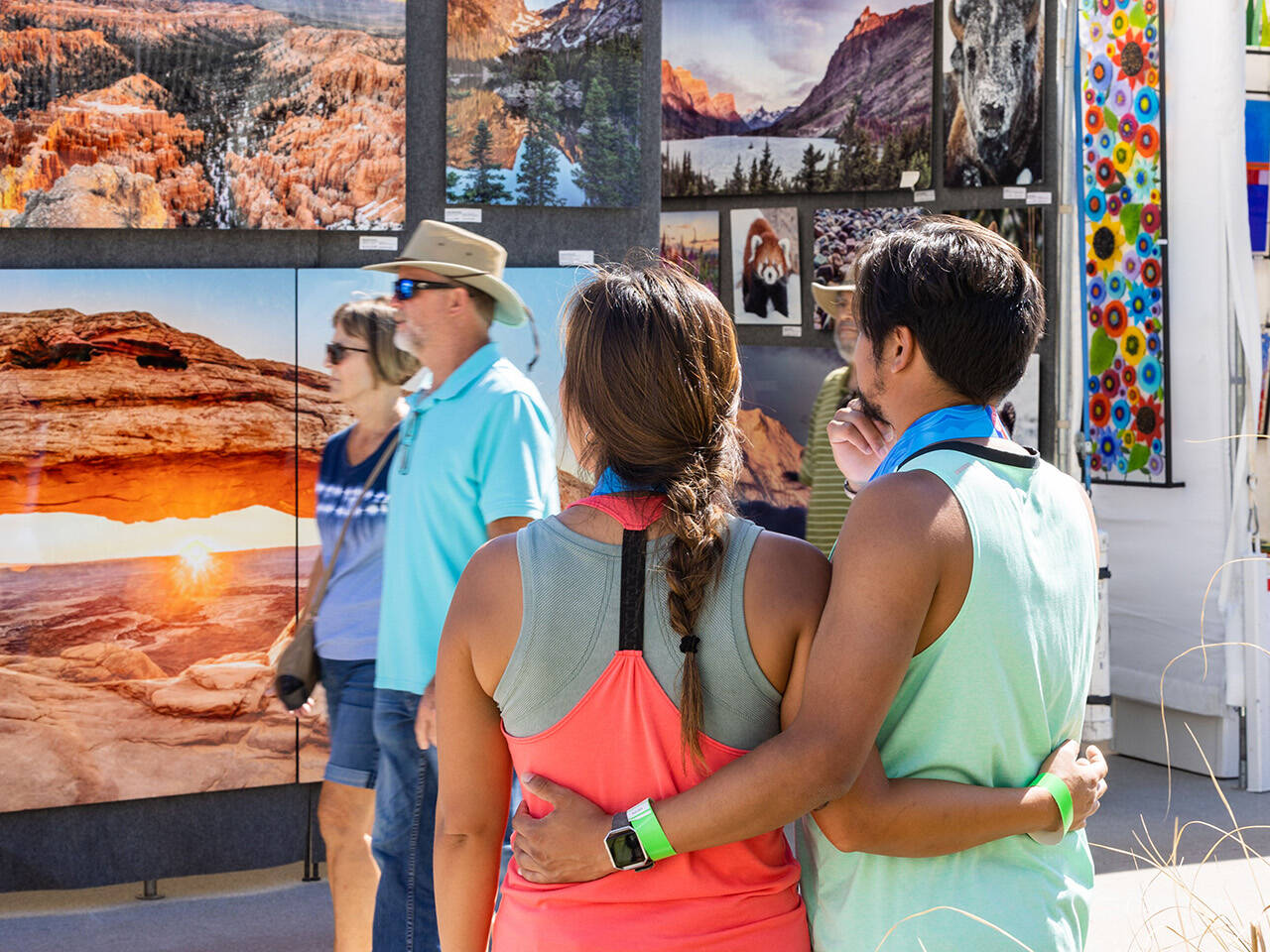 Couple viewing art at Neptune's Art & Craft Show on Boardwalk