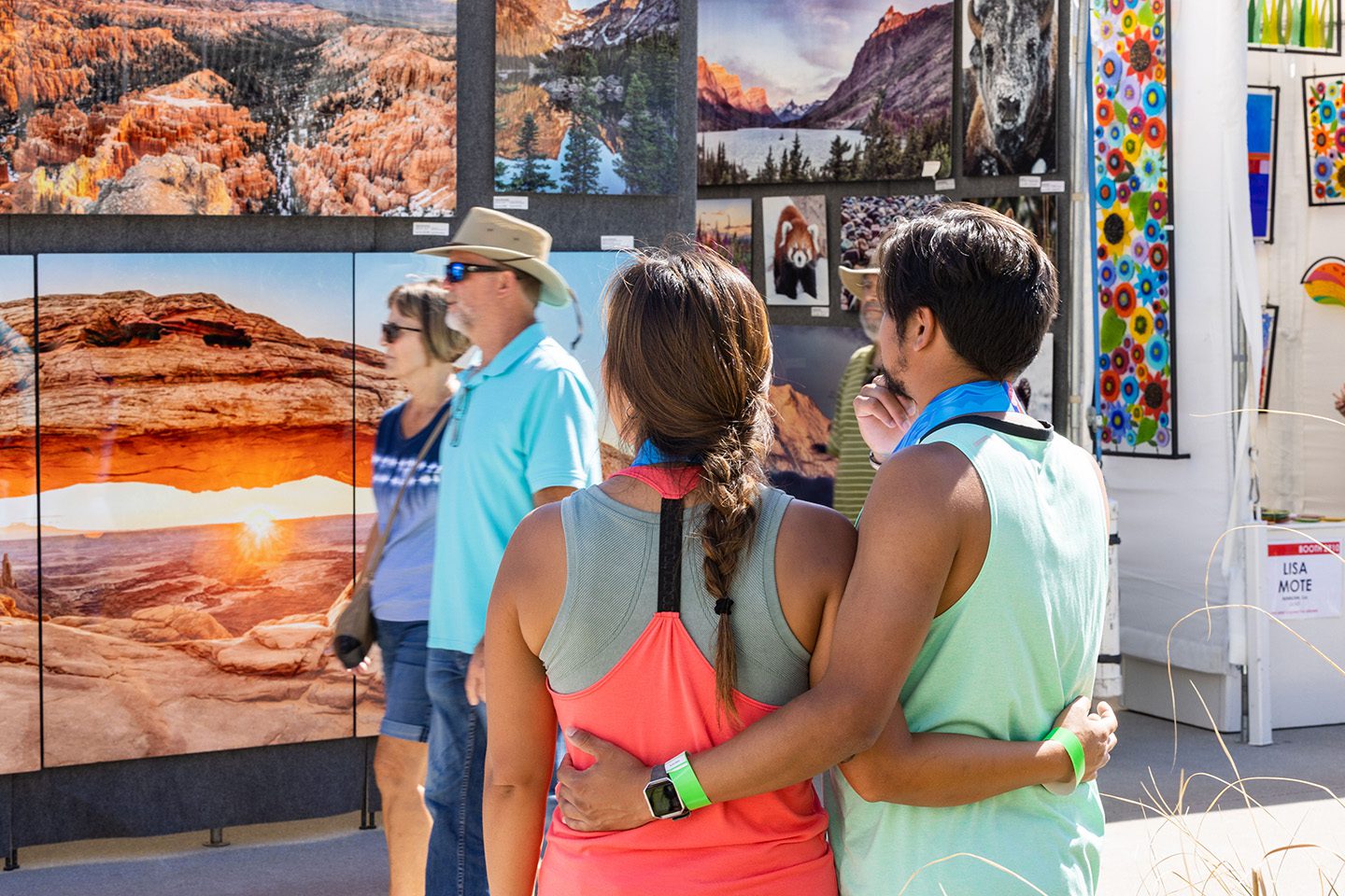 Couple viewing art at Neptune's Art & Craft Show on Boardwalk