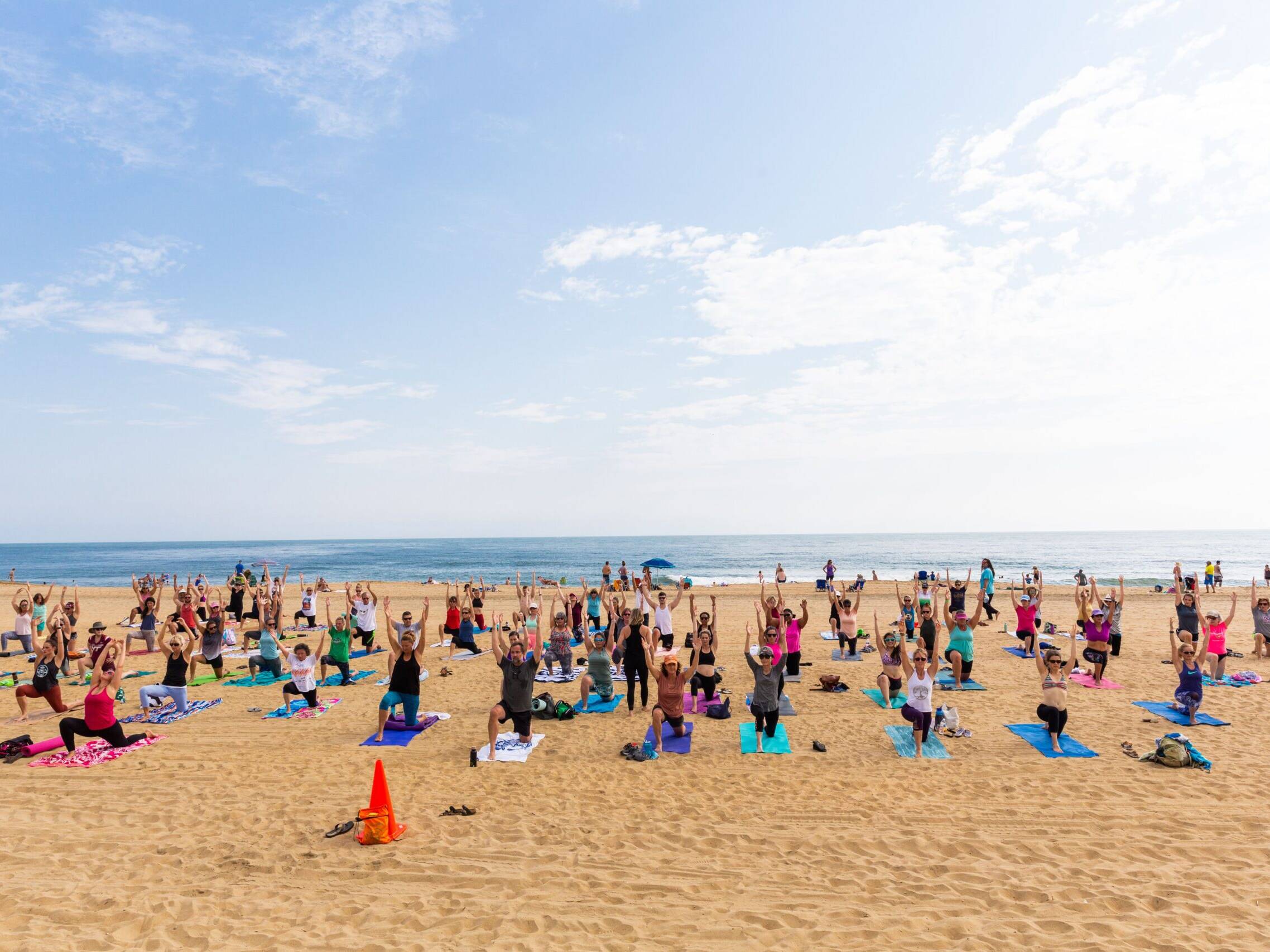Healthy Haven Group gathered on beach for yoga