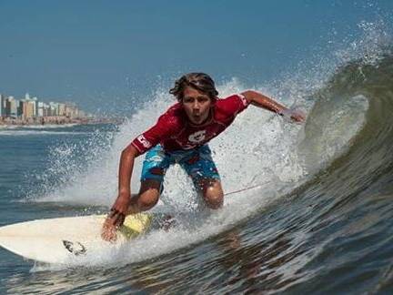 Surfer on wave during Neptune's Surfing Classic