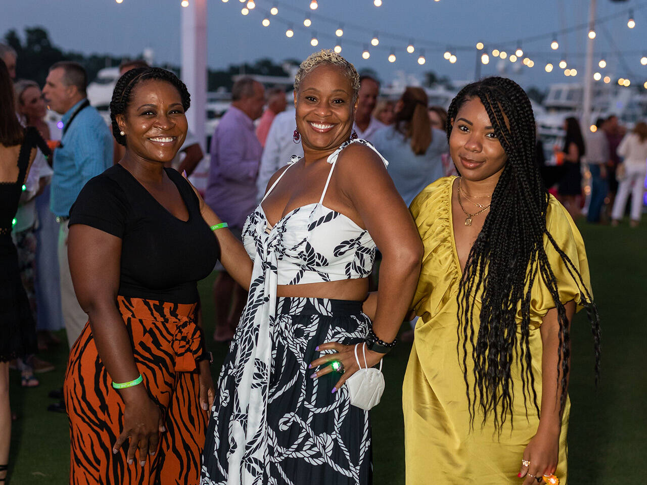 Three women posing at End of Summer Bay Bash