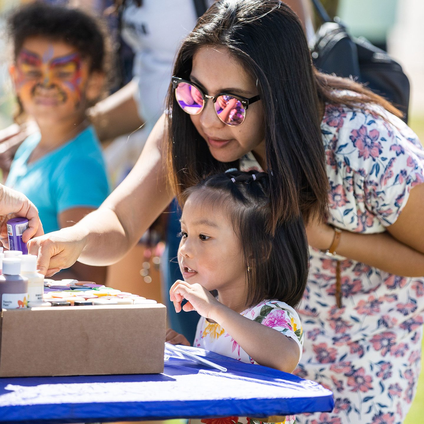 Mother and child looking at crafts during Poseidon's Playground