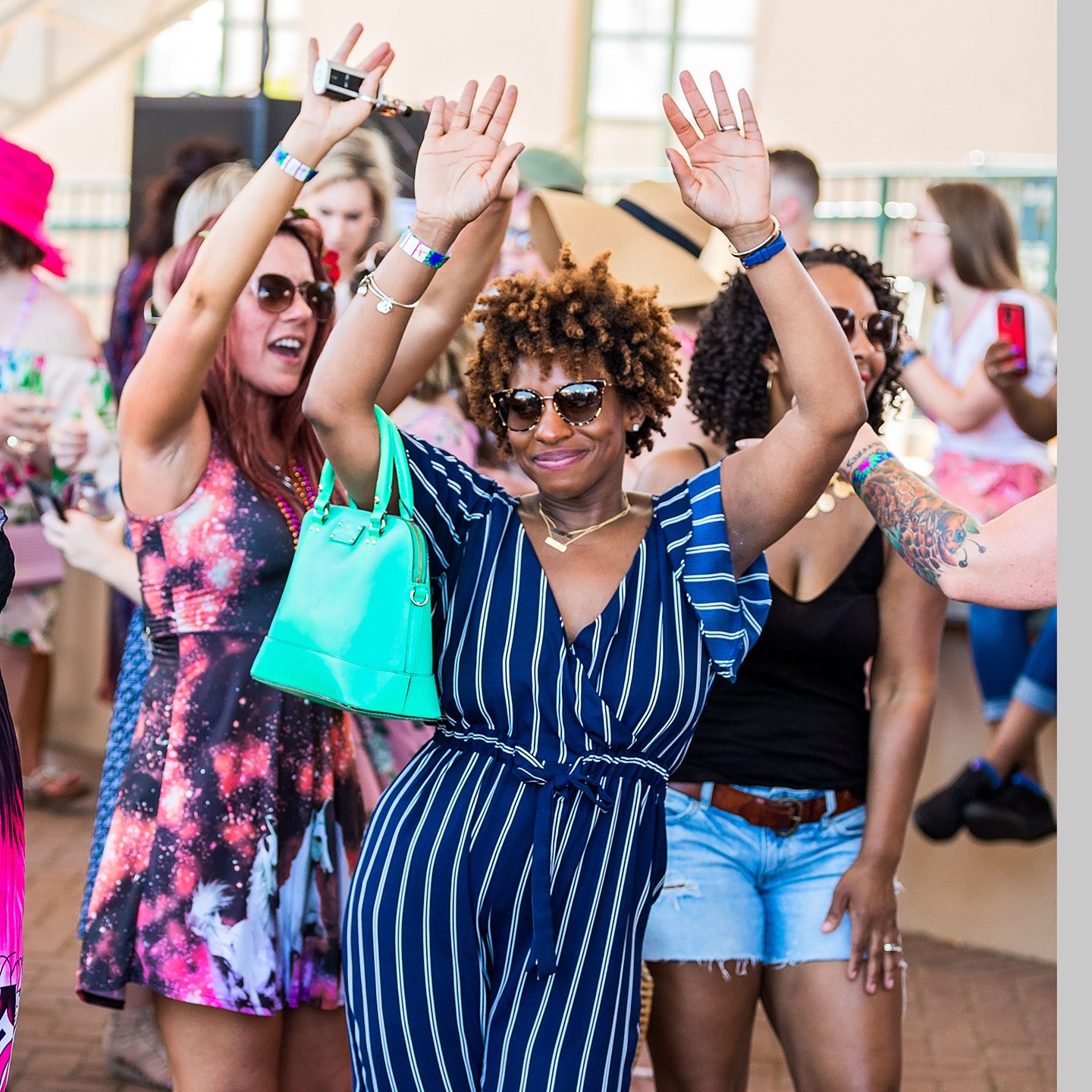 Woman and friends dancing at Neptune Festival Wine Festival