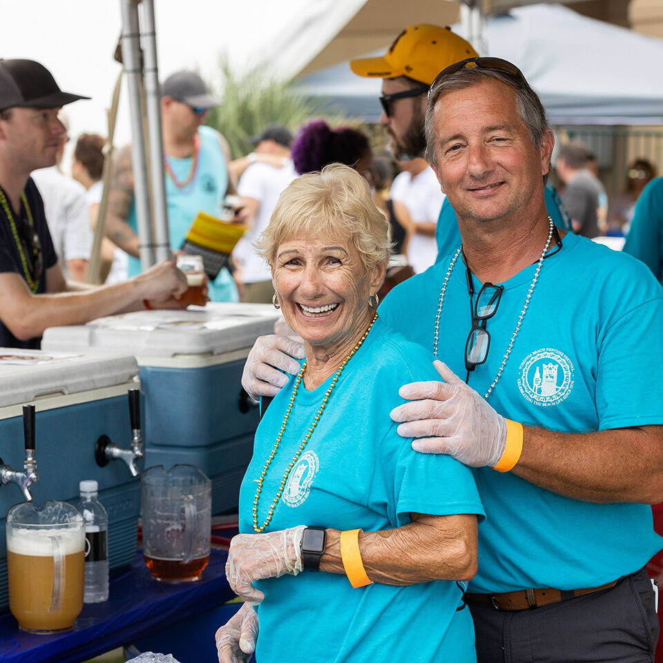 Two volunteers posing for photo at Craft Beer Festival