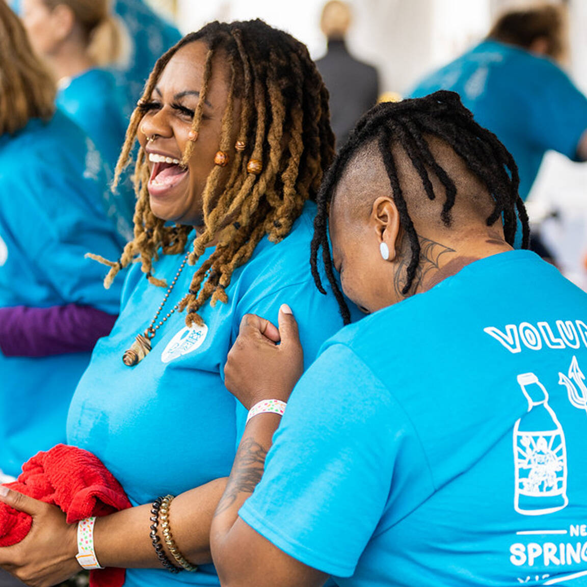 Volunteers laughing at Spring Wine Festival