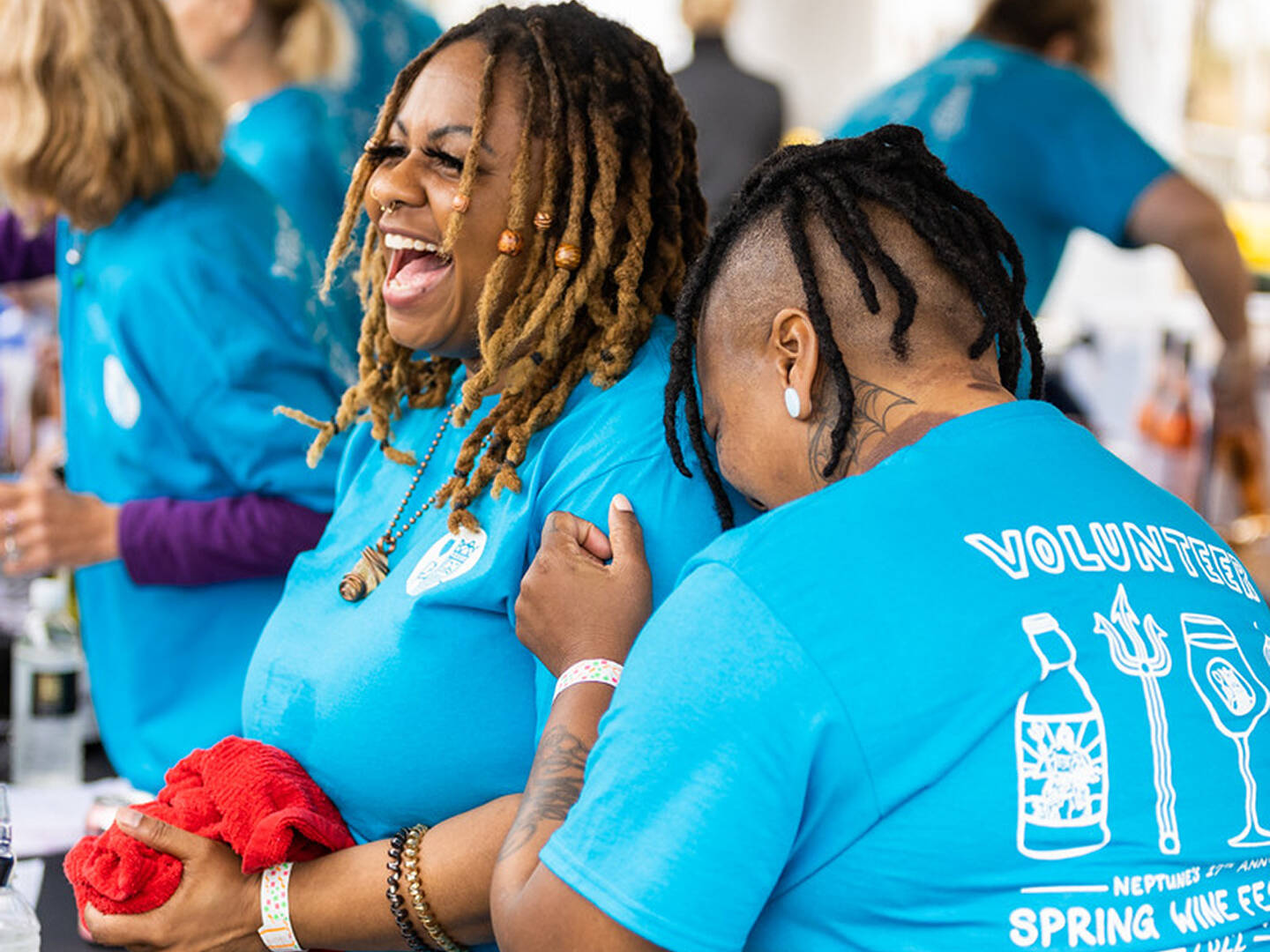 Volunteers laughing at Spring Wine Festival