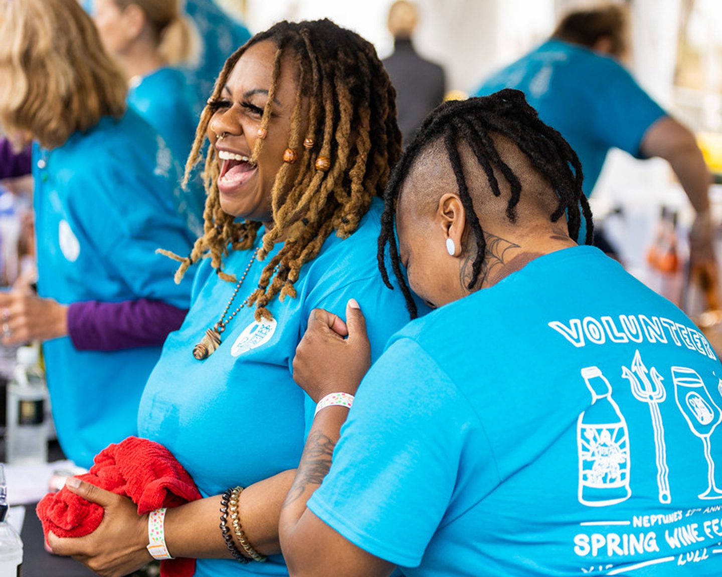 Volunteers laughing at Spring Wine Festival