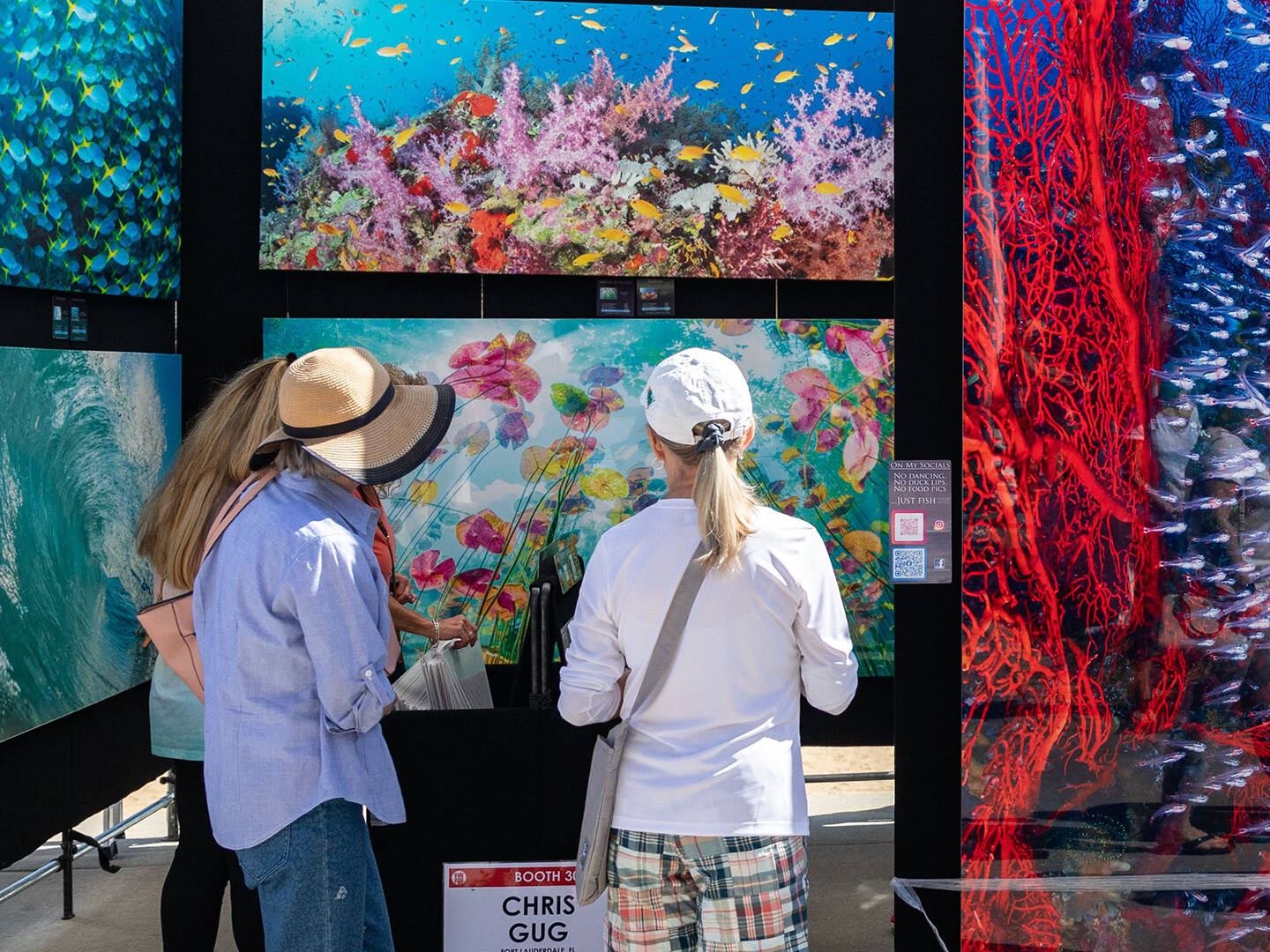 Attendees viewing art at Neptune's Art & Craft Show