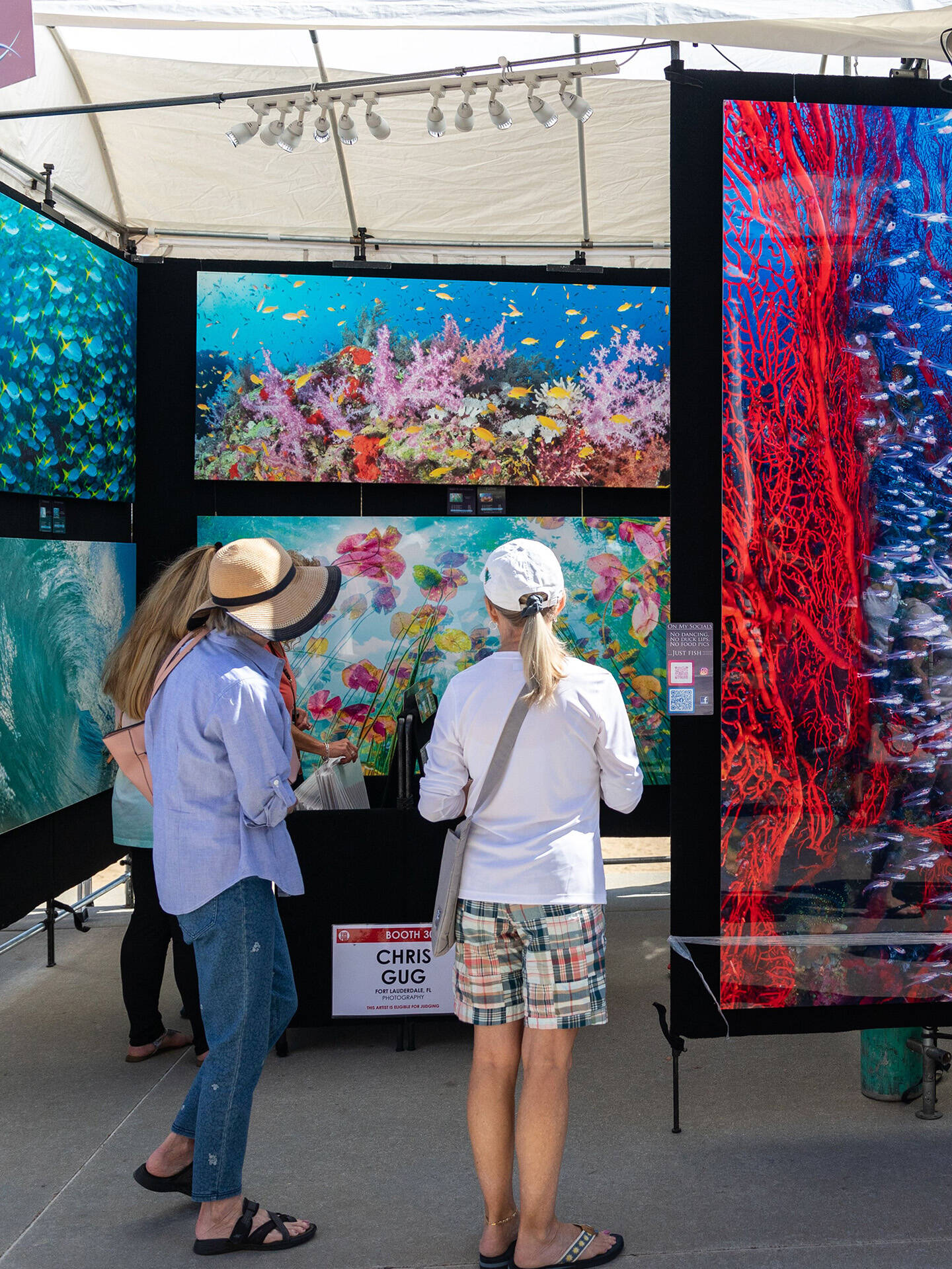 Attendees viewing art at Neptune's Art & Craft Show