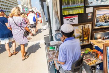 Artist working on Boardwalk during  Neptune Festival Art & Craft Show