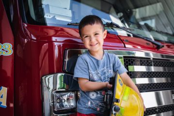 Little kid near fire truck