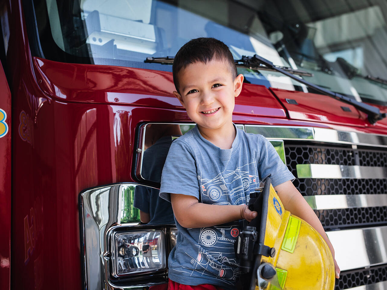 Little kid near fire truck